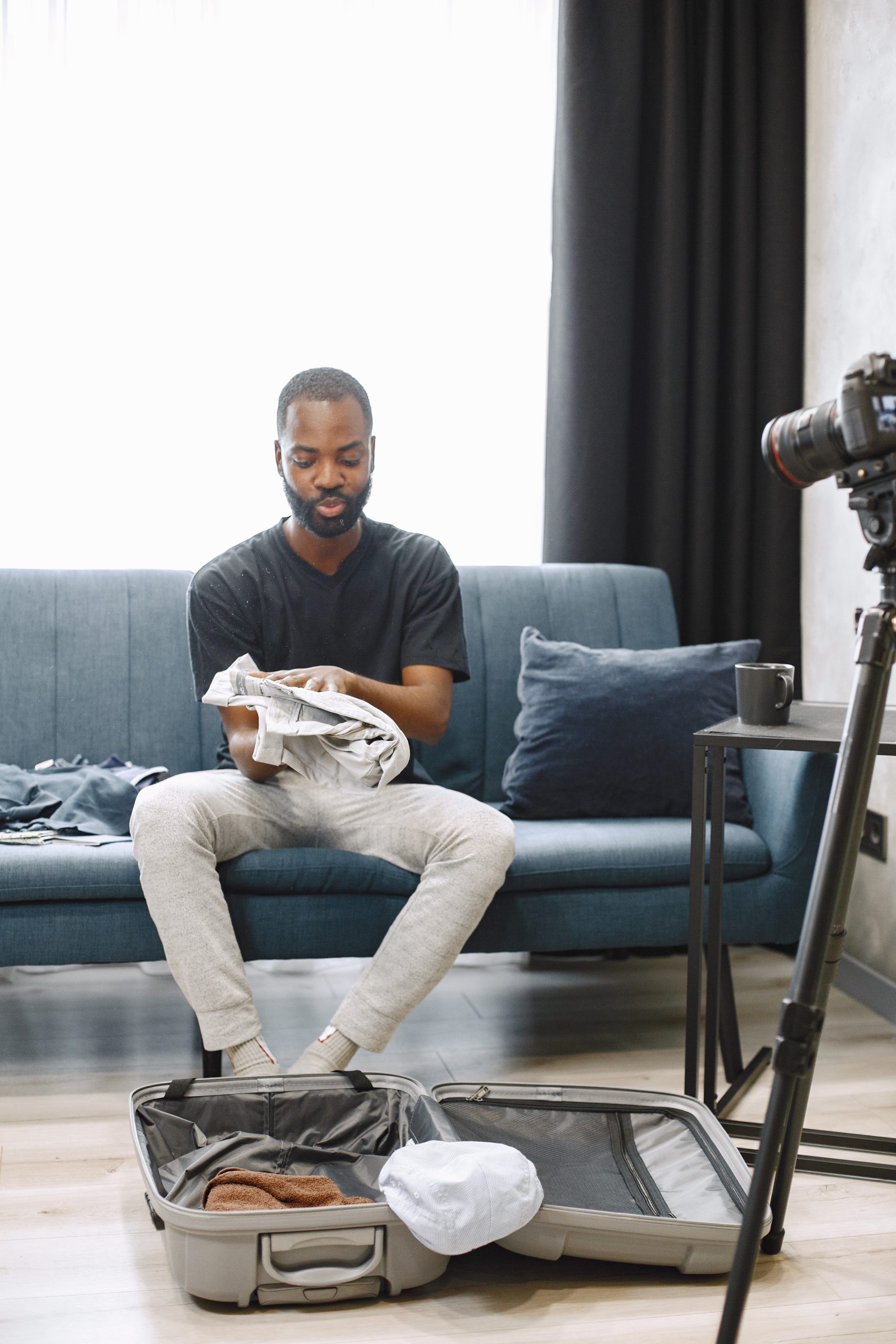 african-male-blogger-recording-vlog-on-digital-cam-2024-12-06-16-19-32-utc