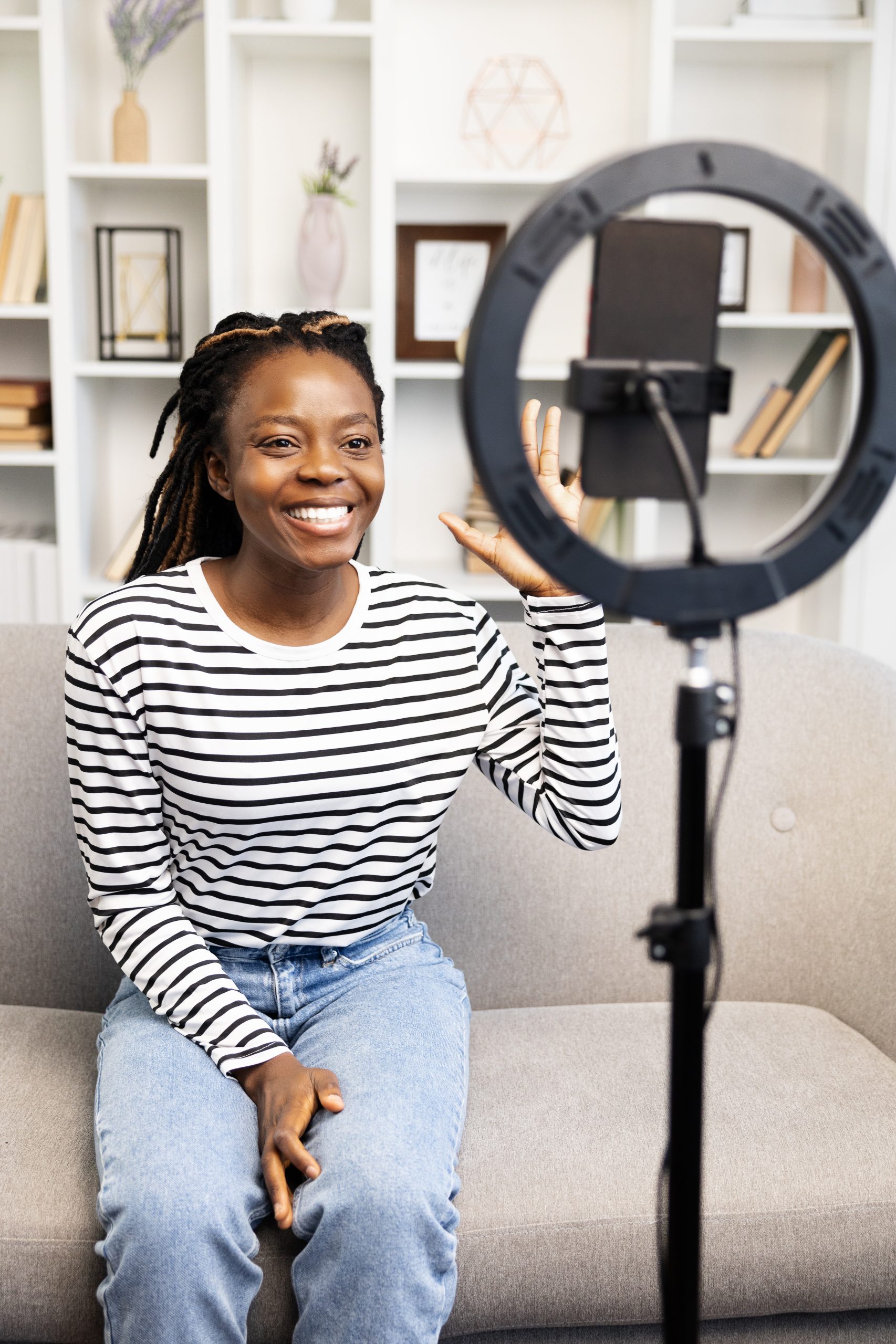 smiling-afro-american-woman-recording-a-video-for-2025-03-08-21-44-24-utc